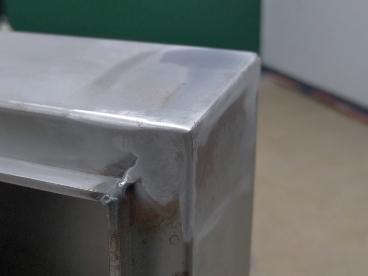 welds grinded and sanded on control panel