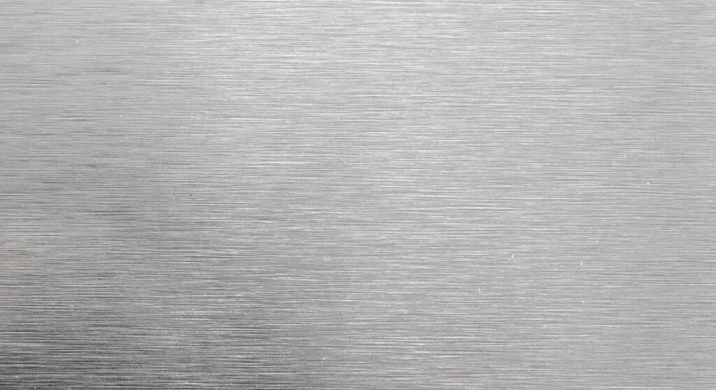 Close up view of stainless steel with graining pattern